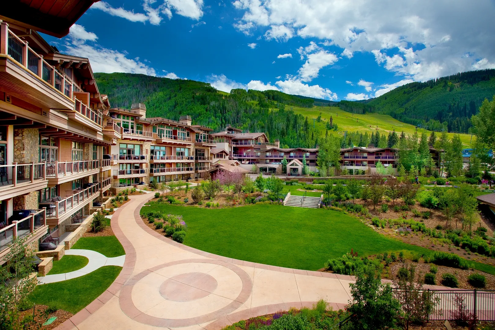Vail corporate holiday party venue Manor Vail Lodge decorated with holiday lights at Golden Peak base