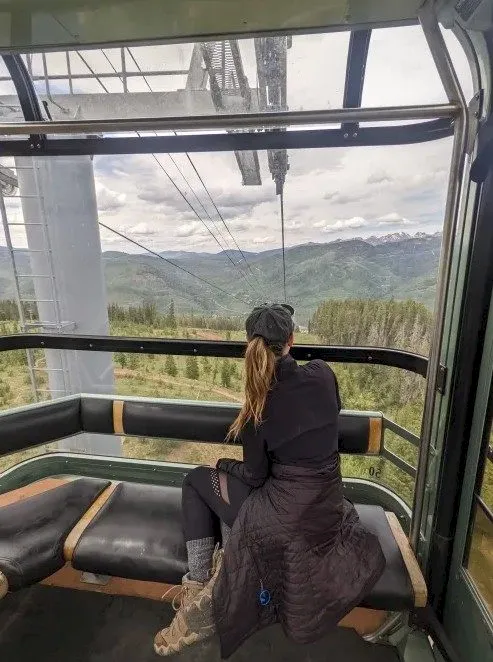 Gondola One interior with scenic mountain views through windows in Vail Colorado